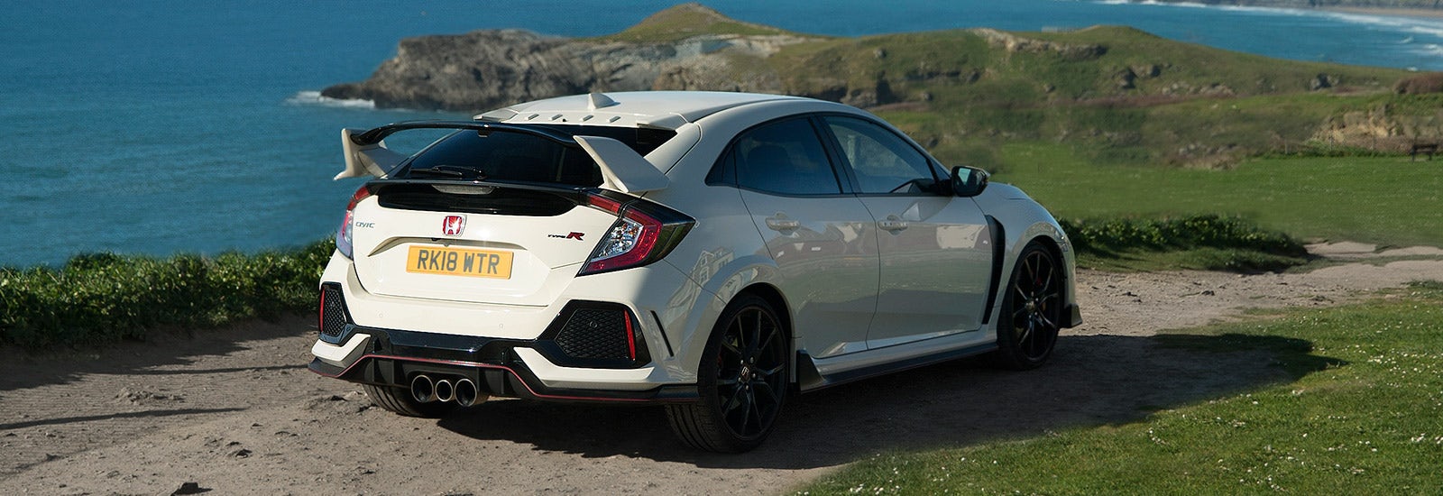 Championship White Honda Civic Type R parked, viewed from behind